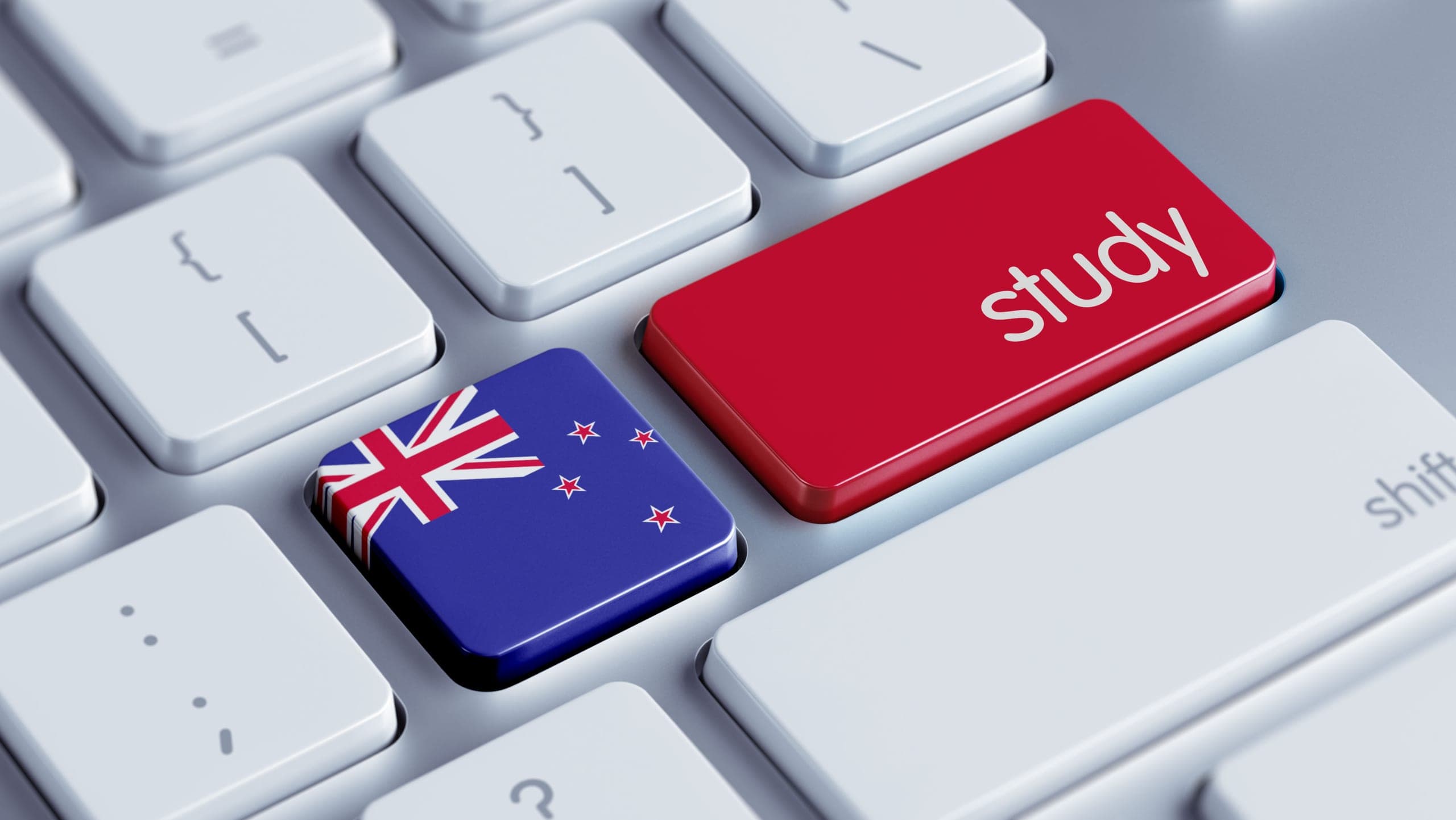 Close-up photo of a keyboard with the New Zealand flag on the quotation marks key and the word 'study' on the return key